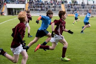 U12 Footballers Play at Half time in All Ireland U21 Football Final