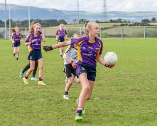 Kilmacud Crokes Under 12 Ladies Footballers at Carryduff GAA blitz in Belfast on 25th of August