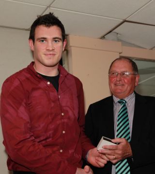 Senior medal presentation by Sean Shanley to James Burke