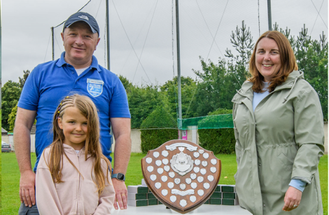 Hurling Cathaoirleach Vinnie Peters, Director Sinéad Casey & U8 Camóg/Footballer Elizabeth Little about to present the Shield!