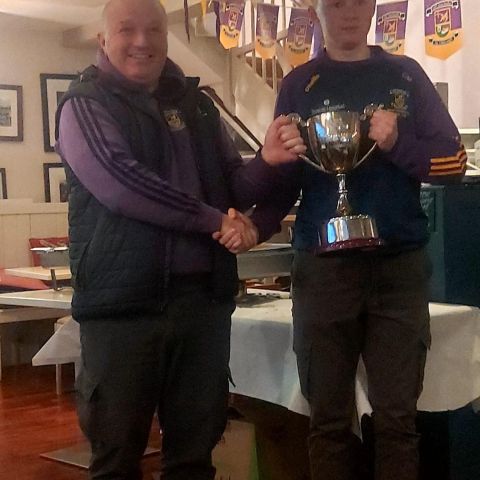 Minor B Captain Conor Mullin presents the Cup to Cathaoirleach Iománaiocht, Vinnie Peters.