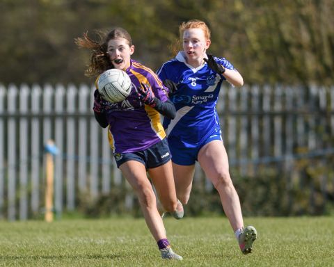 Kilmacud player running with the ball
