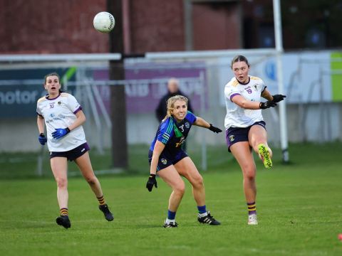 Crokes no 19 kicks ball high into the air