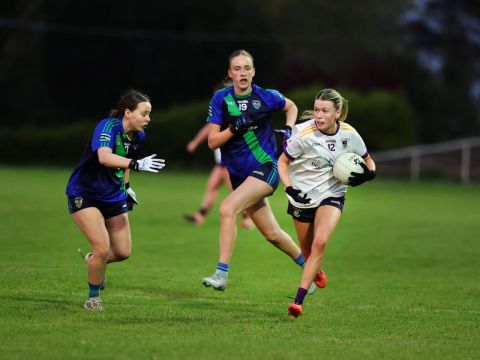 Crokes no 12 holds ball in left hand, running from tackle